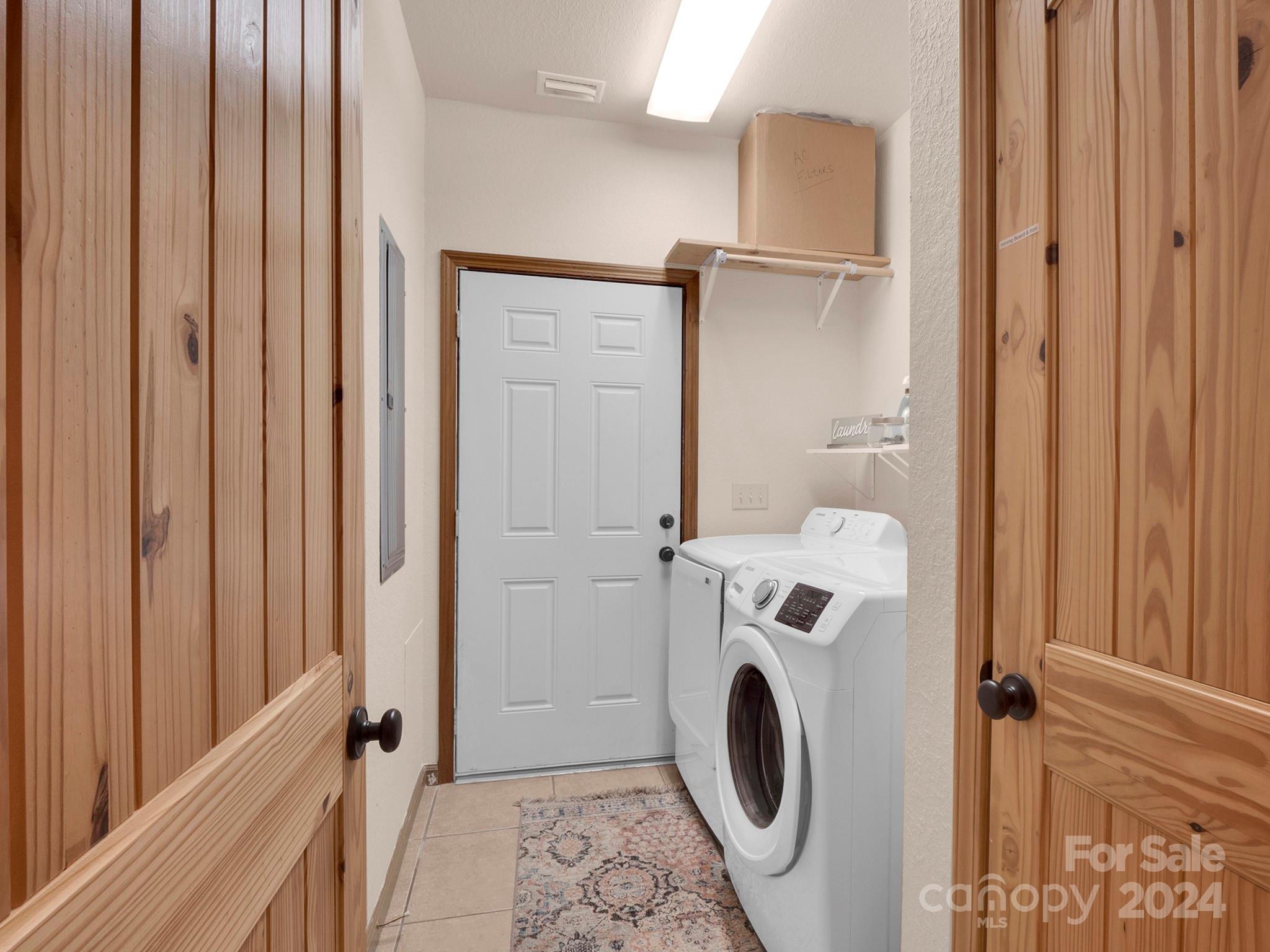 195 Grandview Mesa Road Whittier, NC 28789 - Photo 14 of 37 a view of a bathroom with washer and dryer