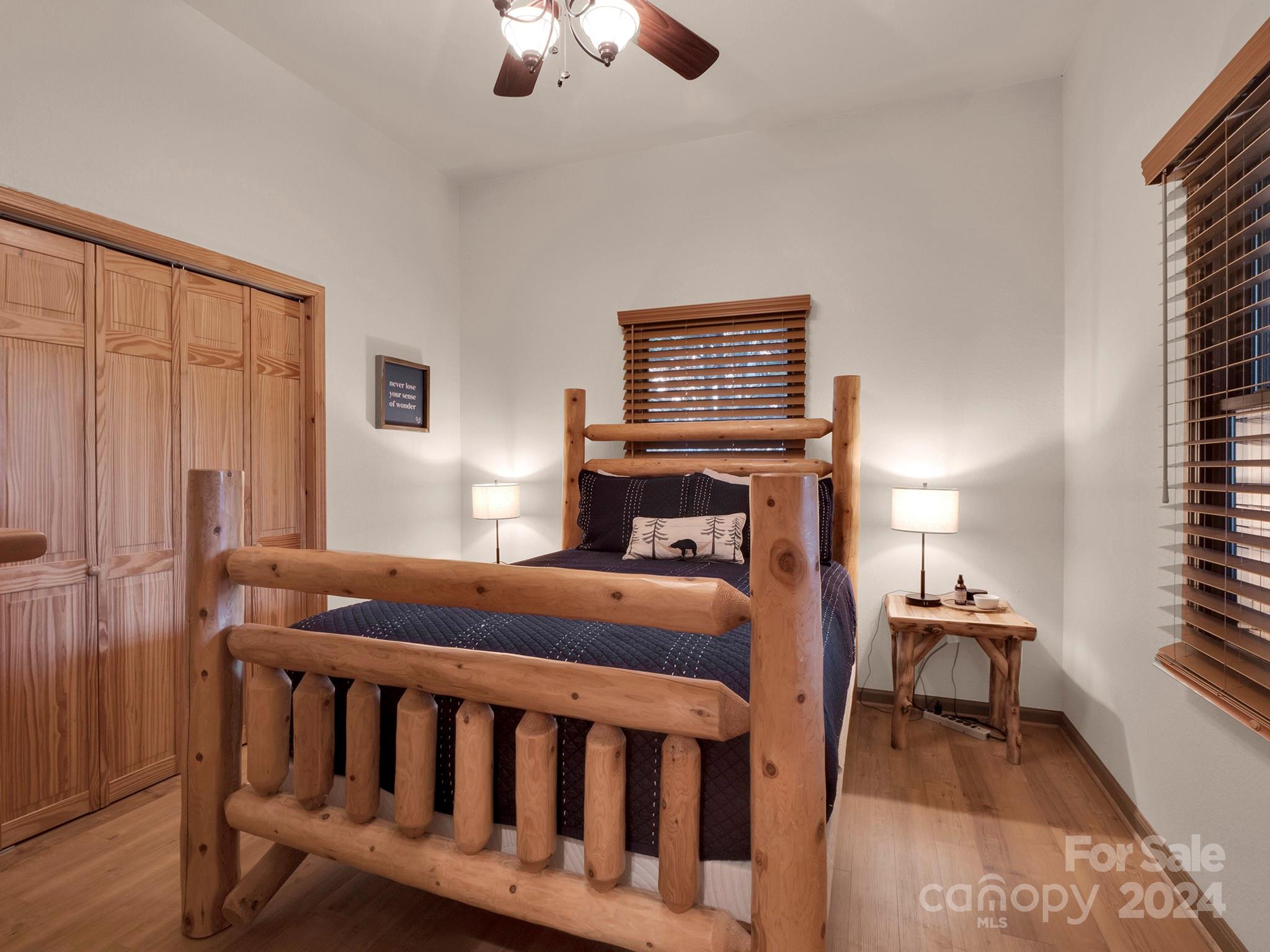 195 Grandview Mesa Road Whittier, NC 28789 - Photo 15 of 37 a bedroom with furniture and a window