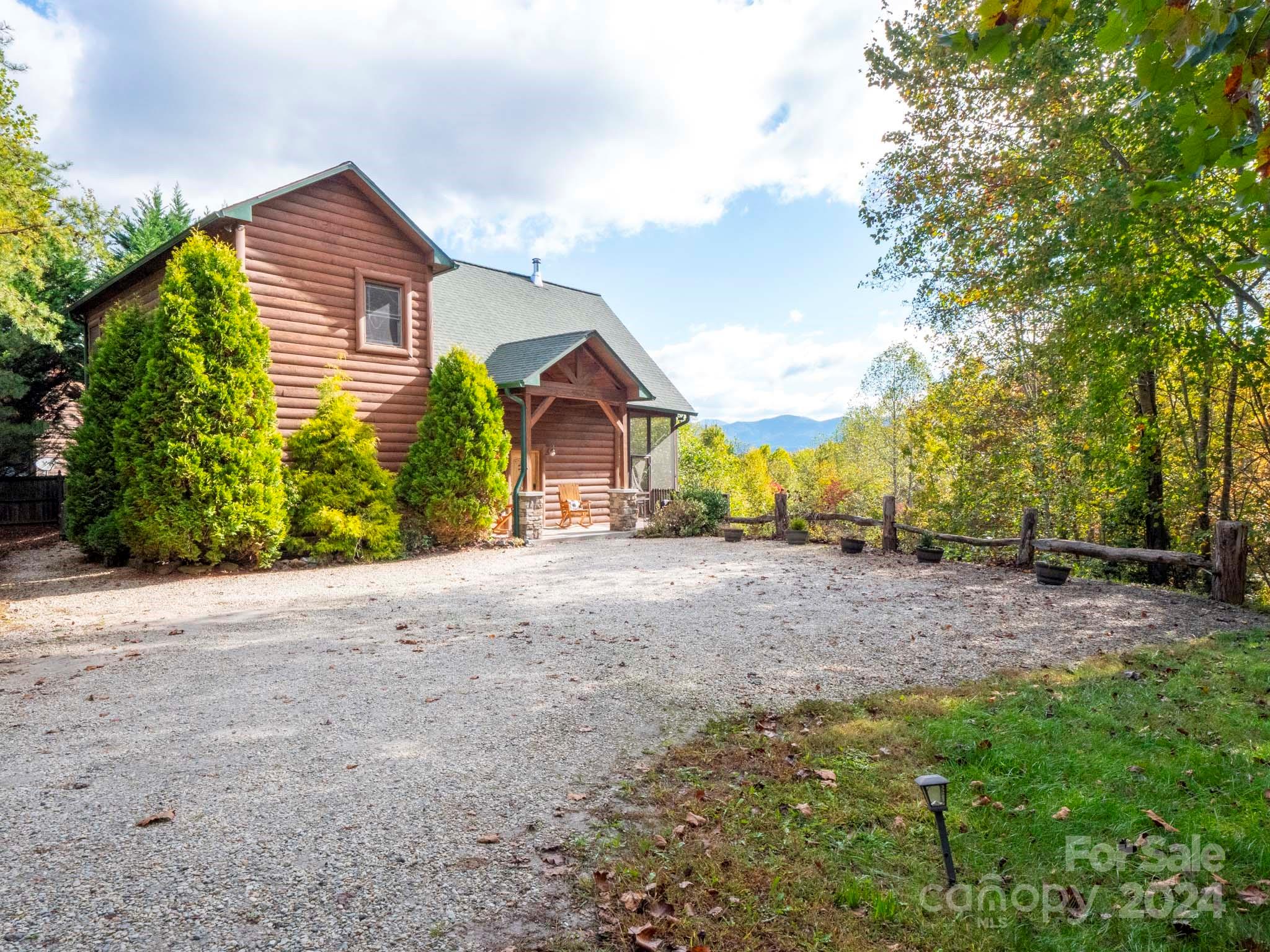 195 Grandview Mesa Road Whittier, NC 28789 - Photo 2 of 37 a view of a house with backyard and trees