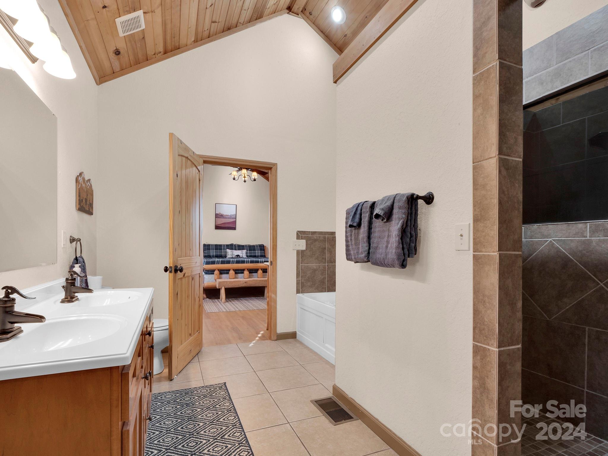 195 Grandview Mesa Road Whittier, NC 28789 - Photo 24 of 37 a hallway with a dining table and chairs