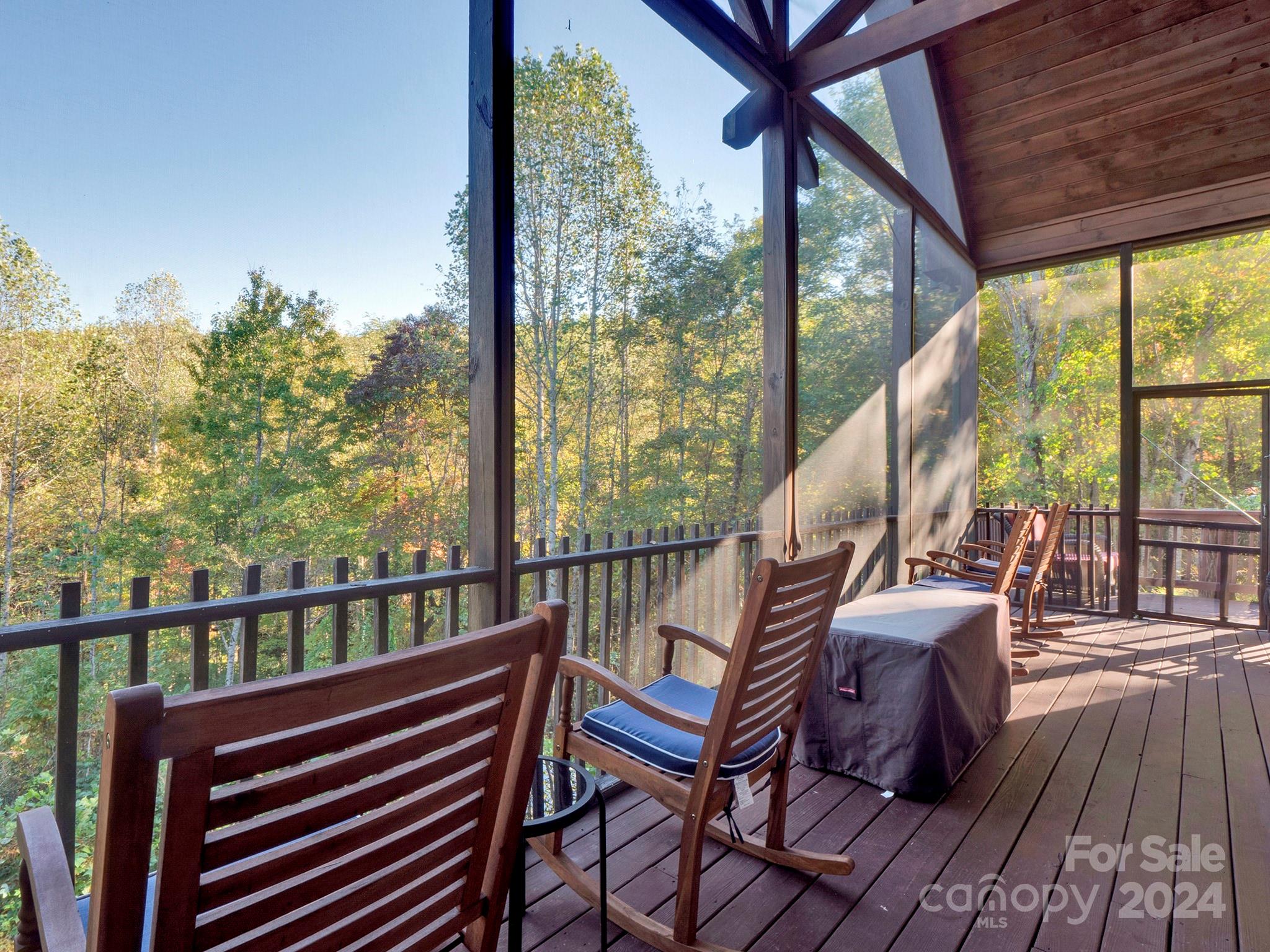 195 Grandview Mesa Road Whittier, NC 28789 - Photo 27 of 37 a view of a balcony with wooden floor and outdoor seating