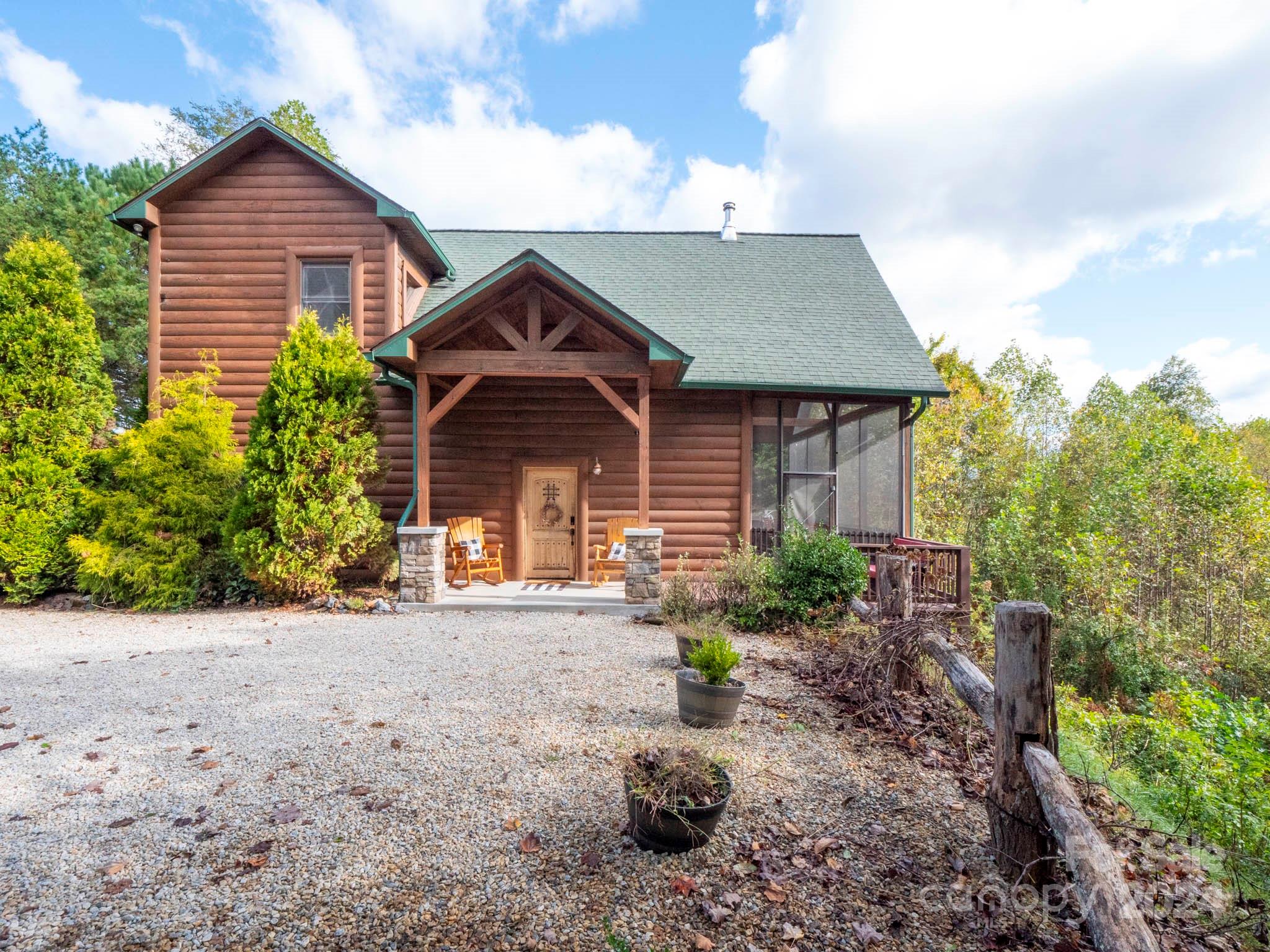 195 Grandview Mesa Road Whittier, NC 28789 - Photo 35 of 37 a front view of a house with garden