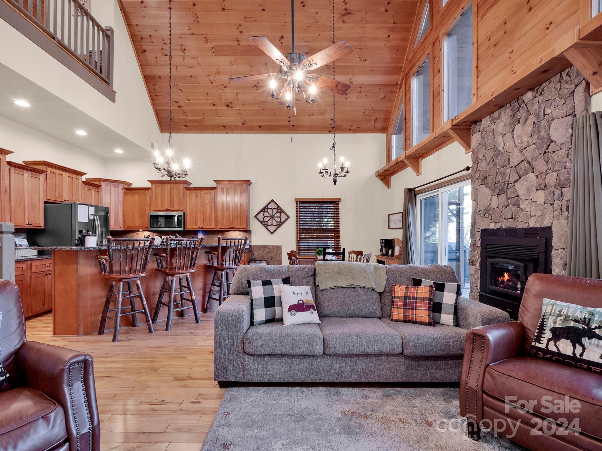 195 Grandview Mesa Road Whittier, NC 28789 - Photo 4 of 37 a living room with furniture and a fireplace