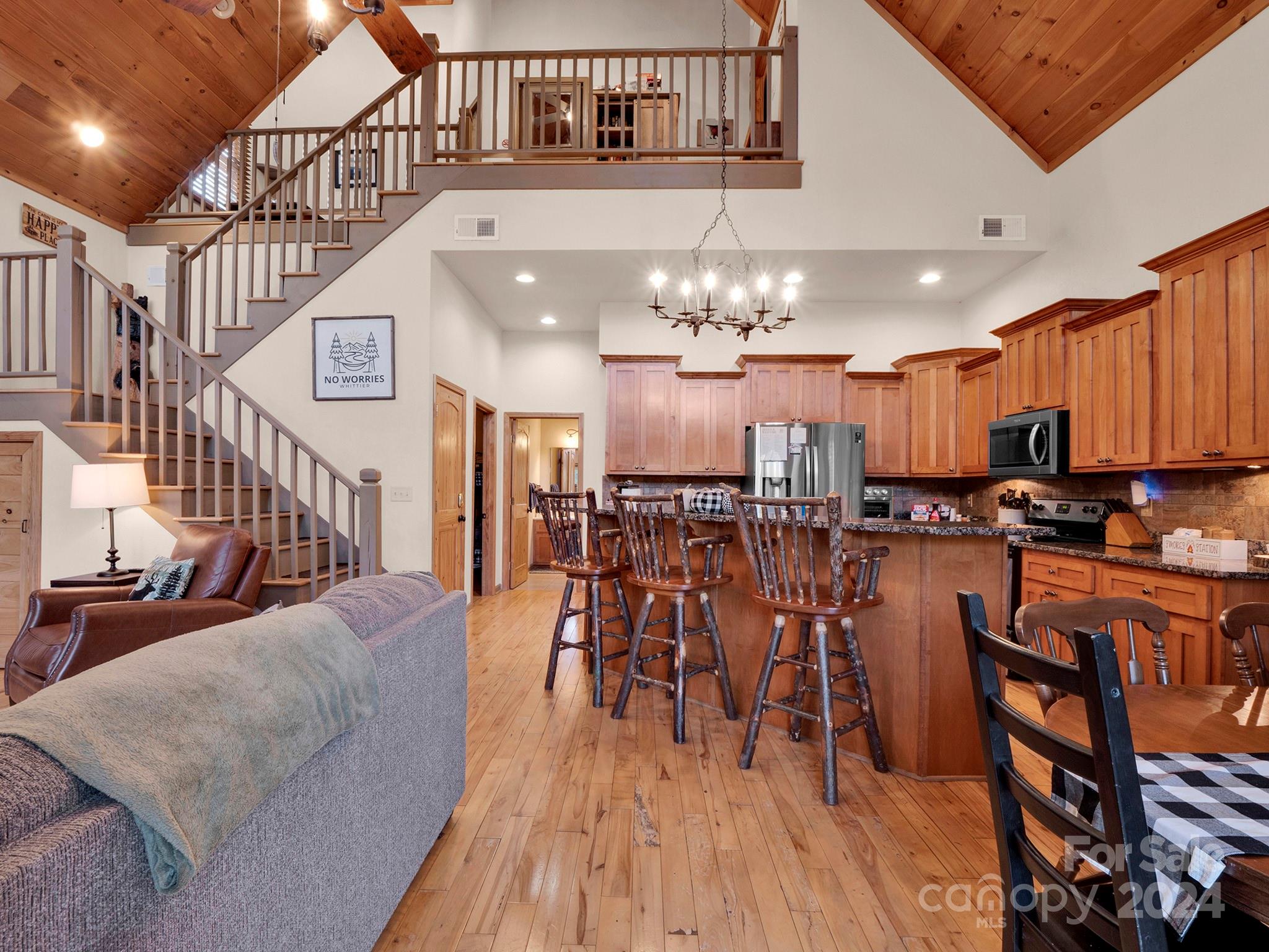 195 Grandview Mesa Road Whittier, NC 28789 - Photo 7 of 37 a view of a dining room with furniture and wooden floor
