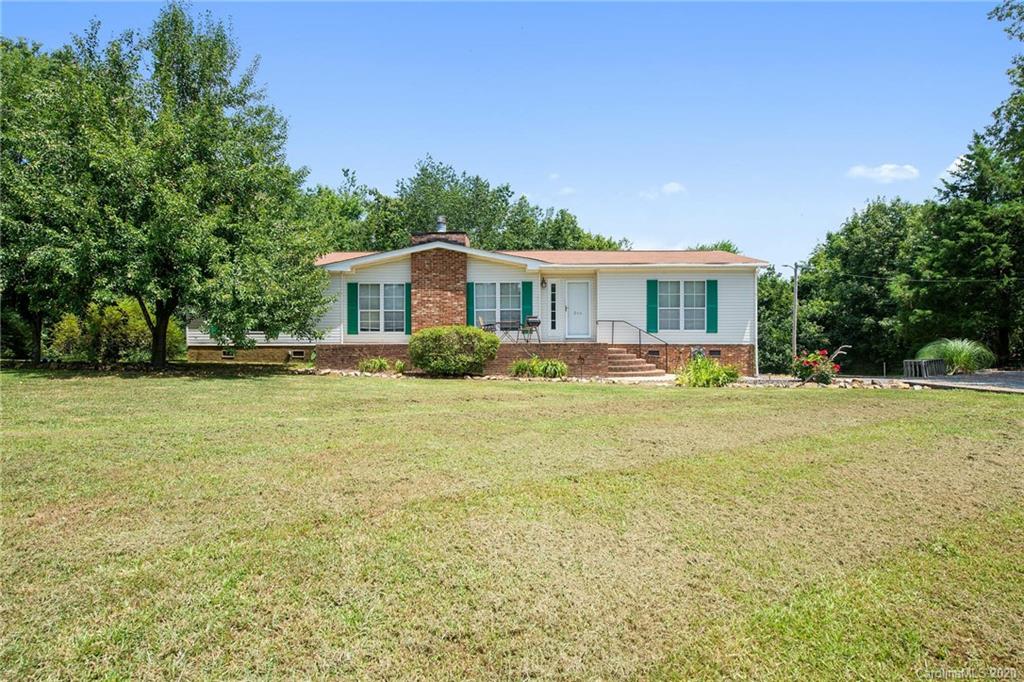 265 Pinecone Road Peachland, NC 28133 - Photo 1 of 35 a front view of house with yard and trees