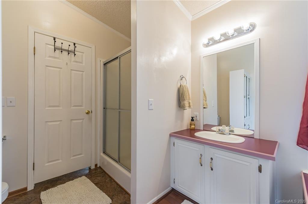 265 Pinecone Road Peachland, NC 28133 - Photo 16 of 35 a bathroom with a sink a mirror and a shower