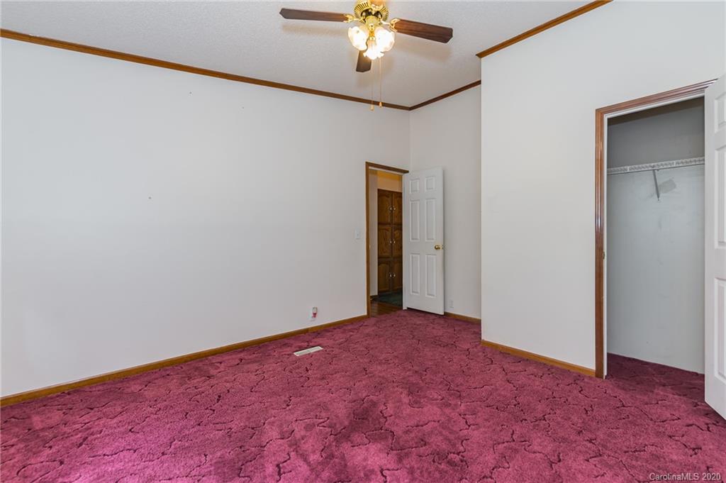 265 Pinecone Road Peachland, NC 28133 - Photo 18 of 35 a view of an empty room with a chandelier fan