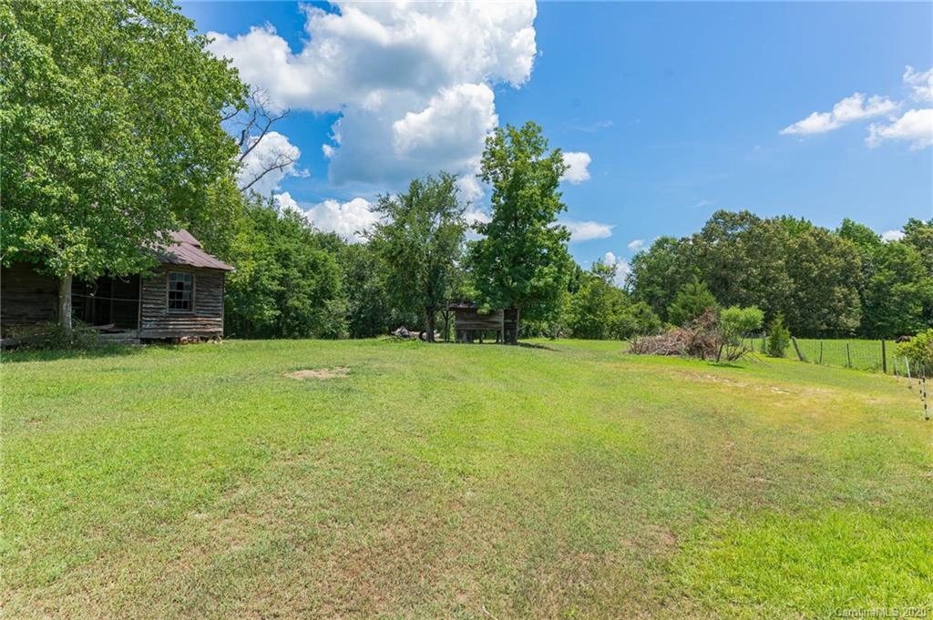 265 Pinecone Road Peachland, NC 28133 - Photo 28 of 35 a backyard of a house with lots of green space