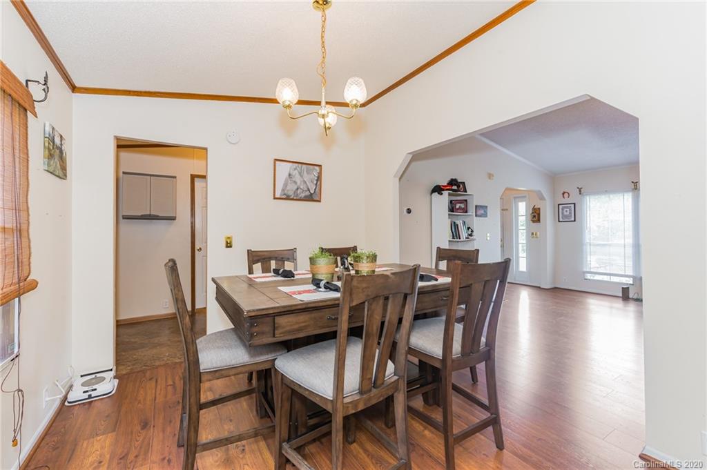 265 Pinecone Road Peachland, NC 28133 - Photo 8 of 35 a view of a dining room with furniture and wooden floor