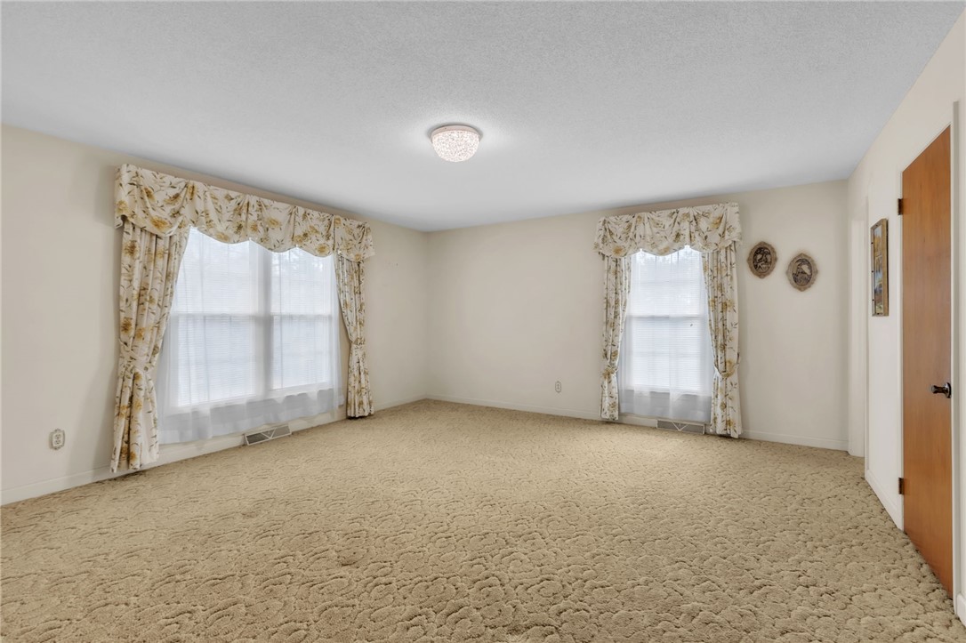 491 City Lake Road Pickens, SC 29671 - Photo 10 of 32 This expansive room offers plush carpeting and ample natural light, ideal for peaceful living.