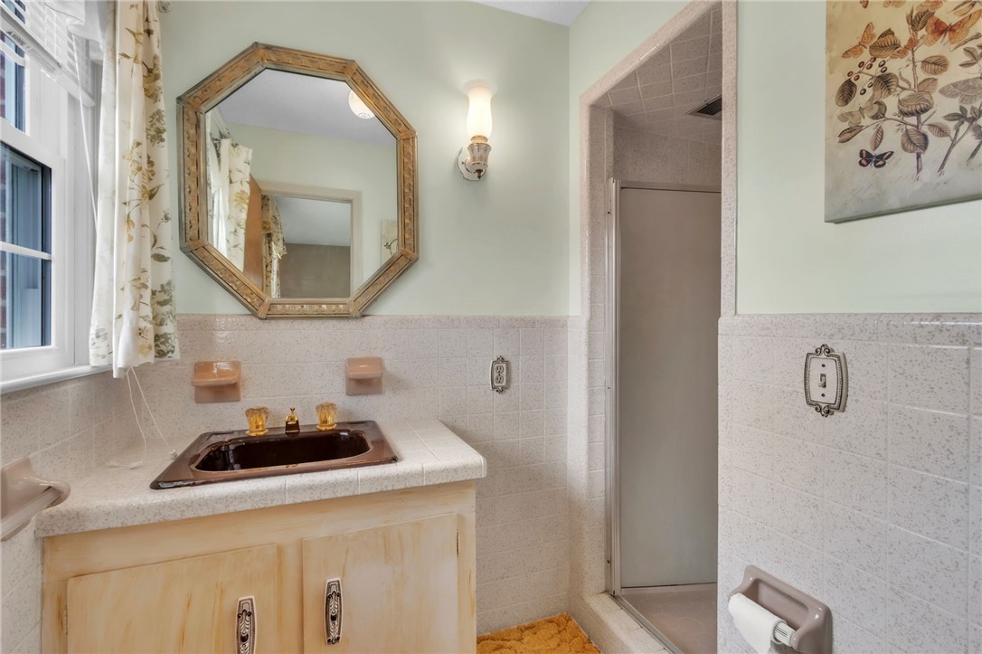 491 City Lake Road Pickens, SC 29671 - Photo 13 of 32 This bright bathroom features ample light, a functional vanity, and a refreshing shower.