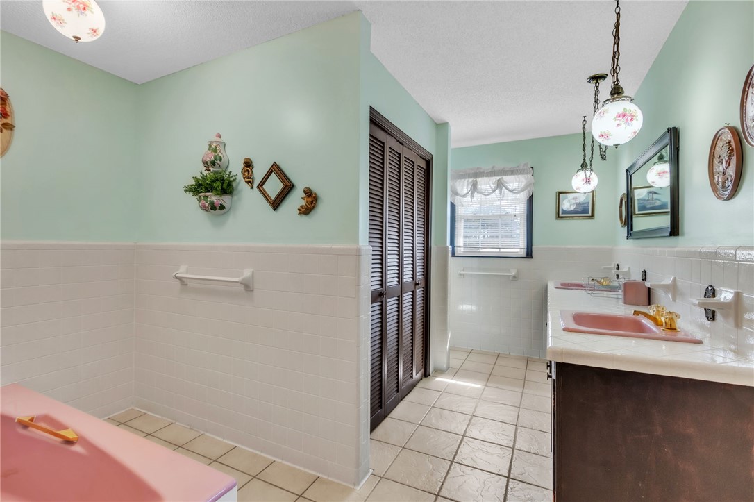 491 City Lake Road Pickens, SC 29671 - Photo 14 of 32 Bright and airy, this bathroom offers a functional layout with classic tiled flooring.