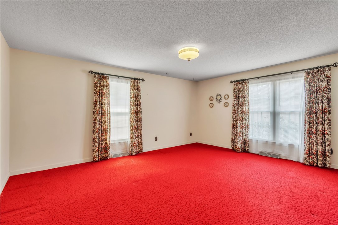 491 City Lake Road Pickens, SC 29671 - Photo 15 of 32 This versatile room offers ample space for relaxation or entertainment, creating an inviting atmosphere.