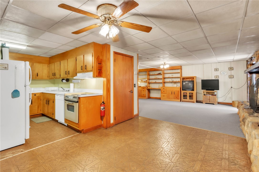 491 City Lake Road Pickens, SC 29671 - Photo 20 of 32 This versatile space combines a functional kitchen area with an inviting living room, perfect for casual gatherings.