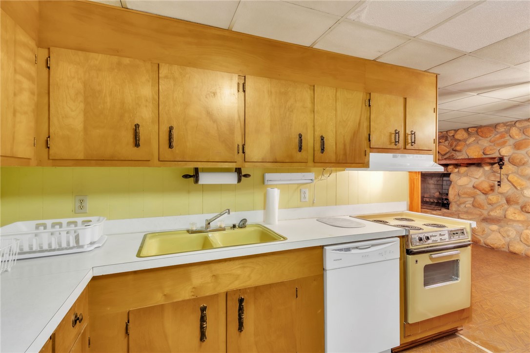 491 City Lake Road Pickens, SC 29671 - Photo 21 of 32 This cozy kitchen features functional appliances and ample cabinetry, ready for your culinary endeavors.