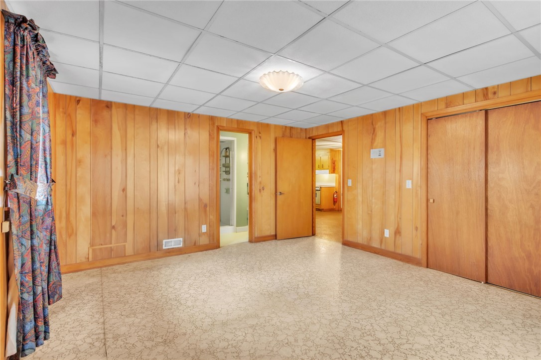 491 City Lake Road Pickens, SC 29671 - Photo 24 of 32 This versatile room features warm wood paneling and easy-care flooring, ready for your personal touch.