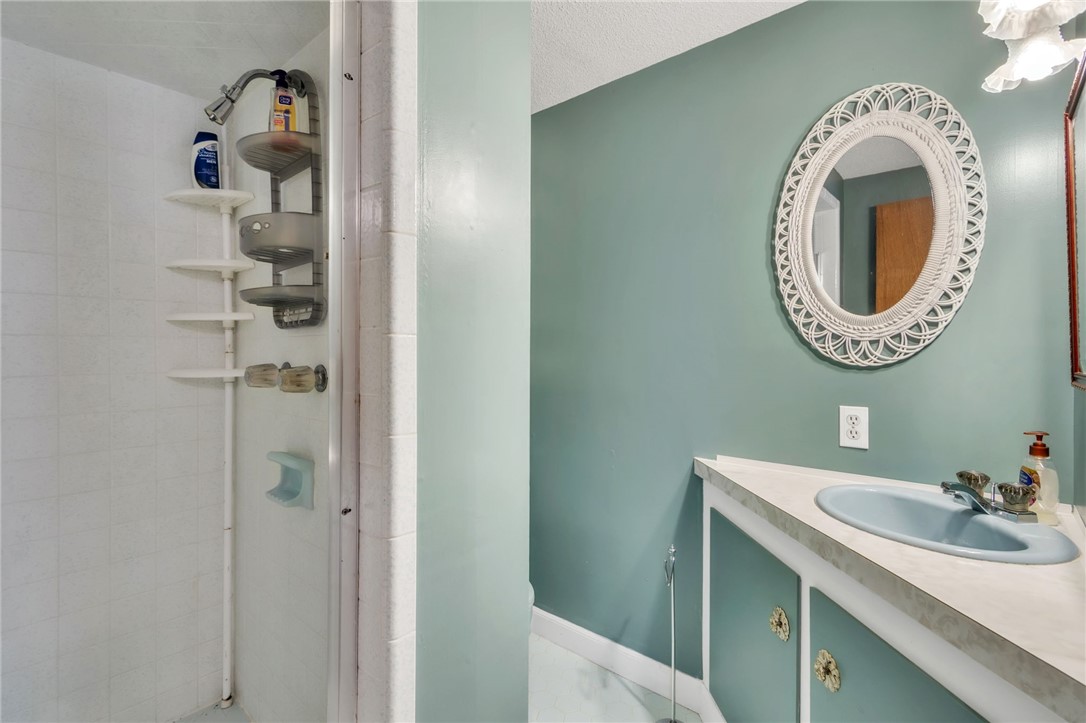 491 City Lake Road Pickens, SC 29671 - Photo 25 of 32 This bathroom features a shower and a vanity with a mirror.