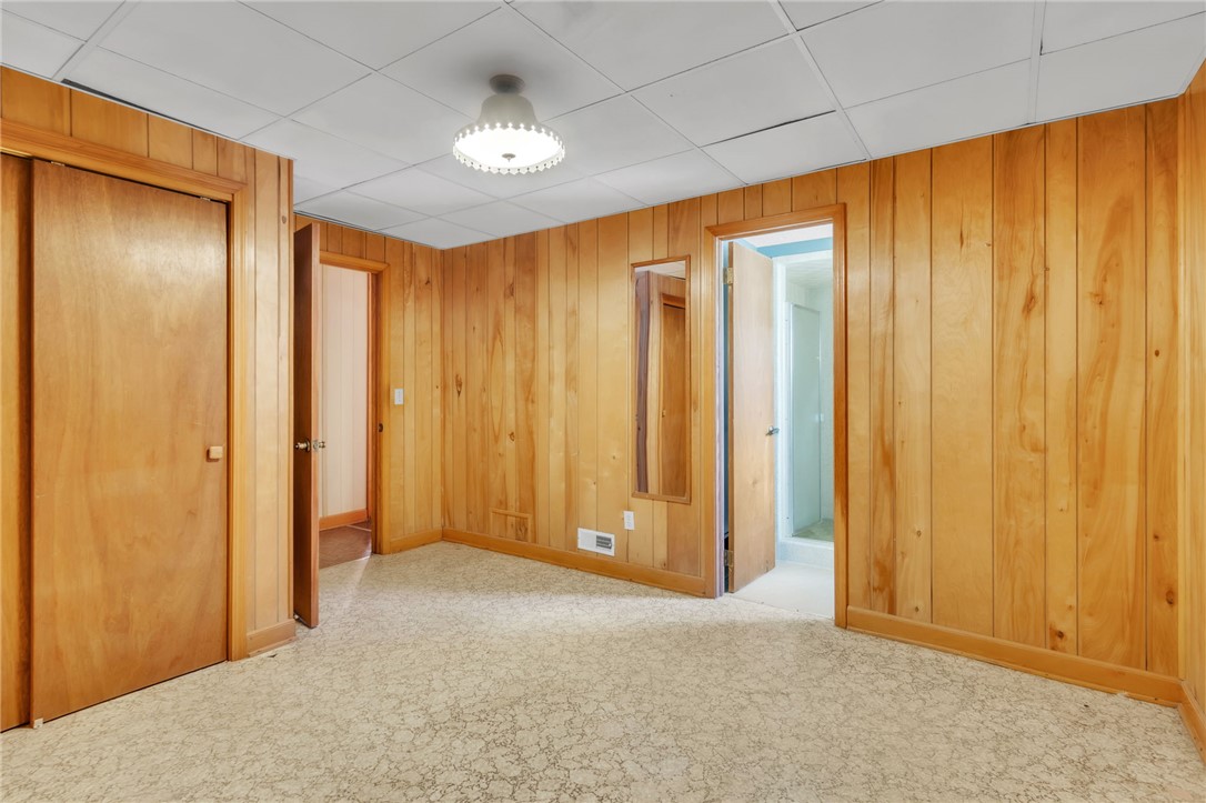 491 City Lake Road Pickens, SC 29671 - Photo 26 of 32 This cozy space features wood paneling and soft flooring, creating a warm and inviting atmosphere.