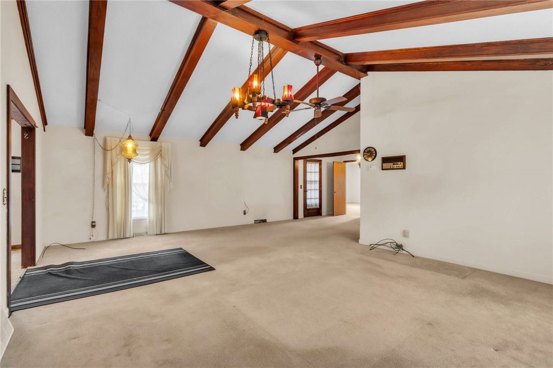 491 City Lake Road Pickens, SC 29671 - Photo 4 of 32 This expansive great room features vaulted beamed ceilings and ample natural light, ideal for comfortable living.