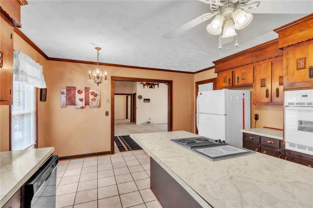 491 City Lake Road Pickens, SC 29671 - Photo 9 of 32 This kitchen features a practical layout with traditional cabinetry and essential appliances.