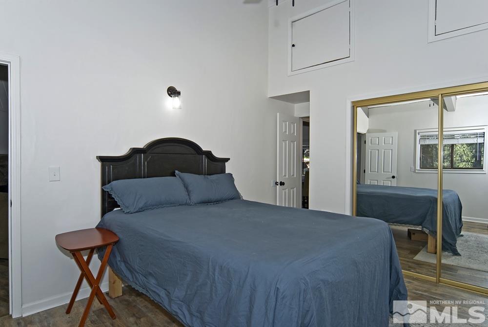 190 Pinon Road Markleeville, CA 96120 - Photo 17 of 31 a bedroom with a bed and a chair with the view