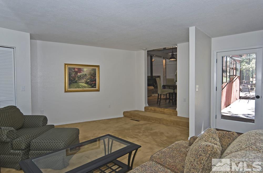 190 Pinon Road Markleeville, CA 96120 - Photo 20 of 31 a bedroom with a bed and wooden floor