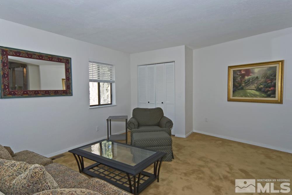 190 Pinon Road Markleeville, CA 96120 - Photo 21 of 31 a living room with furniture and paintings on the wall