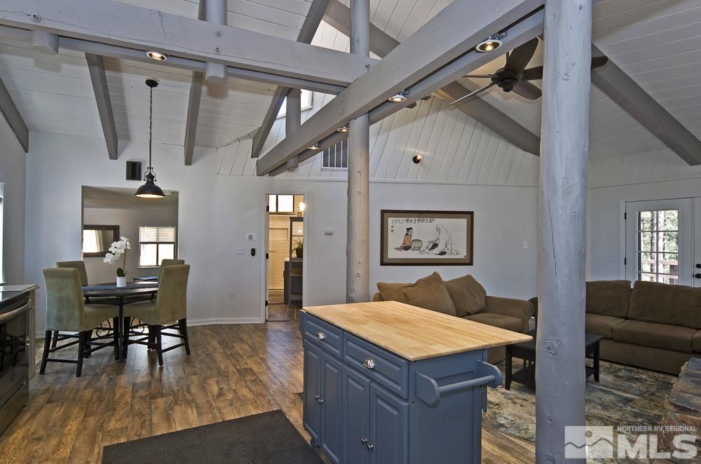 190 Pinon Road Markleeville, CA 96120 - Photo 7 of 31 a living room with furniture a dining table and a wooden floor