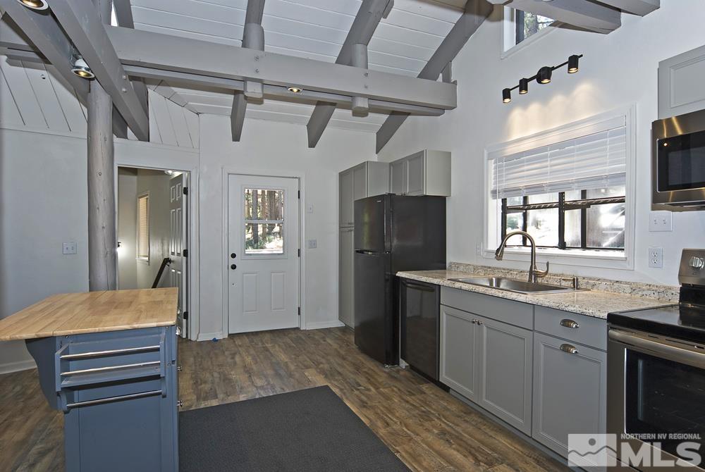 190 Pinon Road Markleeville, CA 96120 - Photo 9 of 31 a kitchen with stainless steel appliances granite countertop a refrigerator and a sink