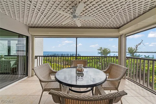 a view of a balcony with a table and chairs