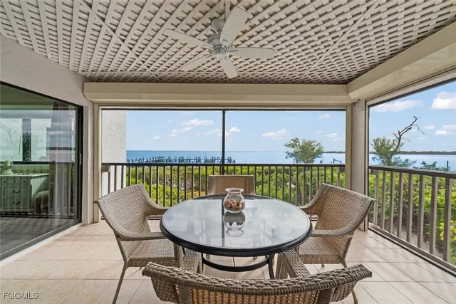 a view of a balcony with a table and chairs