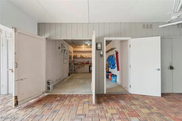 a view of a livingroom with wooden floor and white doors