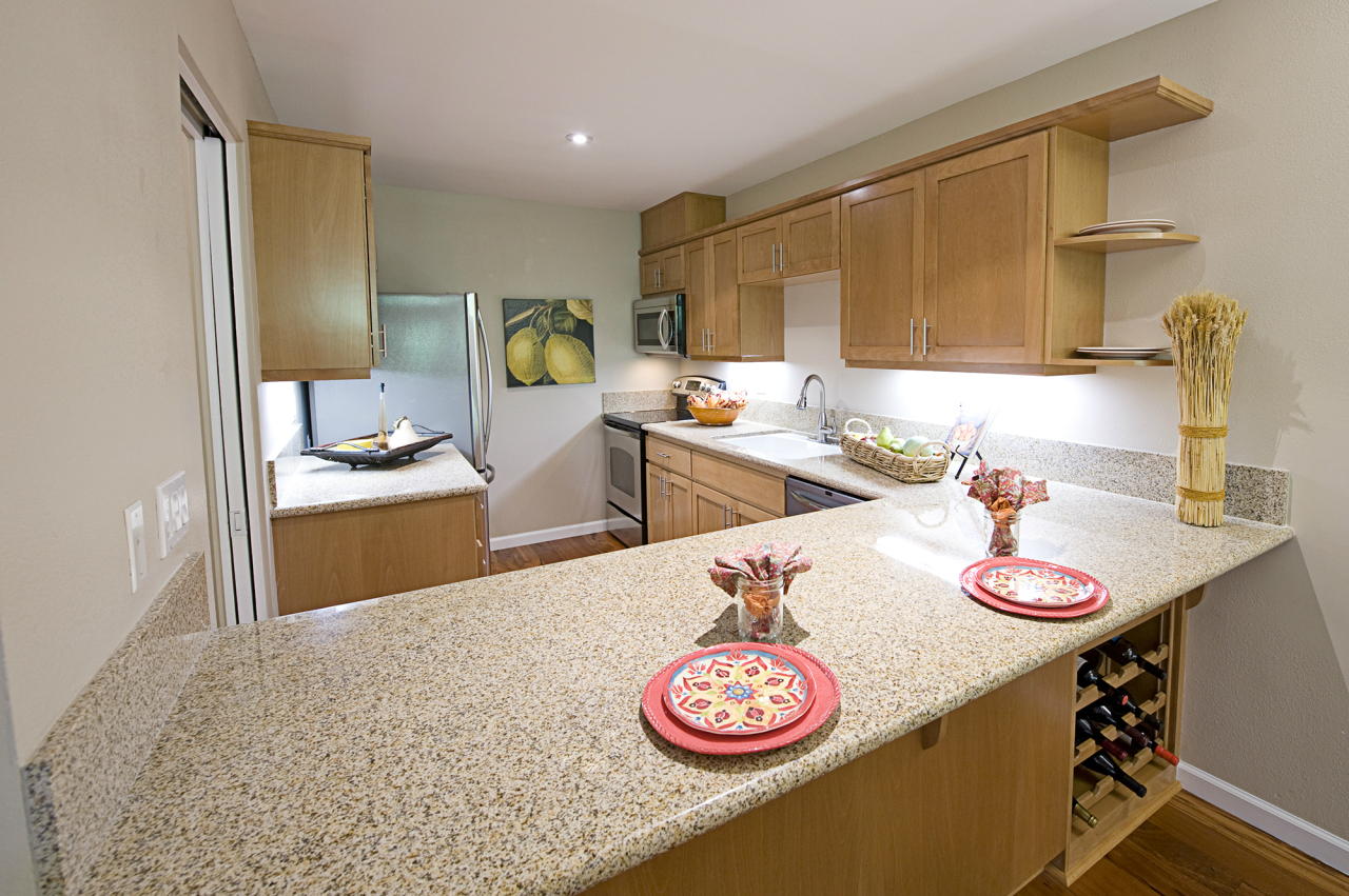 1220 Coast Village Road, Unit 111 Montecito, CA 93108 - Photo 5 of 13 a kitchen with stainless steel appliances granite countertop a sink and cabinets