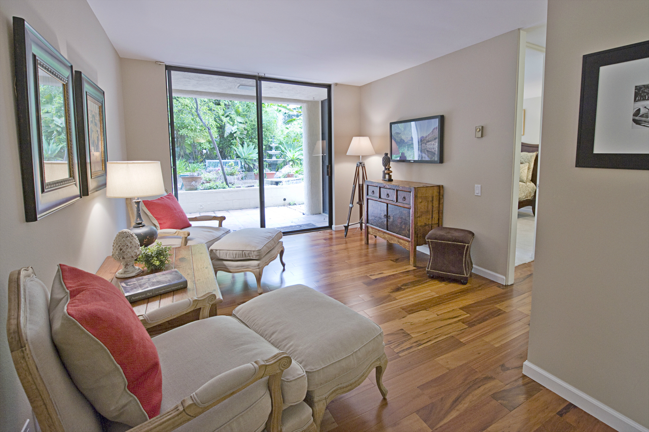 1220 Coast Village Road, Unit 111 Montecito, CA 93108 - Photo 6 of 13 a living room with furniture and a large window