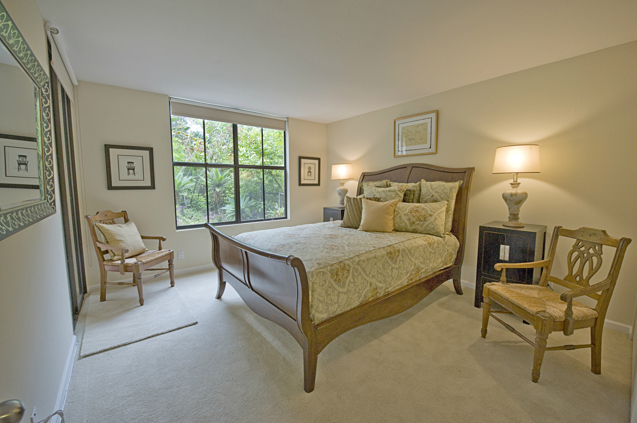 1220 Coast Village Road, Unit 111 Montecito, CA 93108 - Photo 10 of 13 a bed sitting in a bedroom next to a window