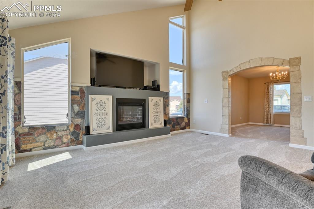 7863 Buschborn Road Peyton, CO 80831 - Photo 15 of 50 a view of an empty room with a fireplace and a window