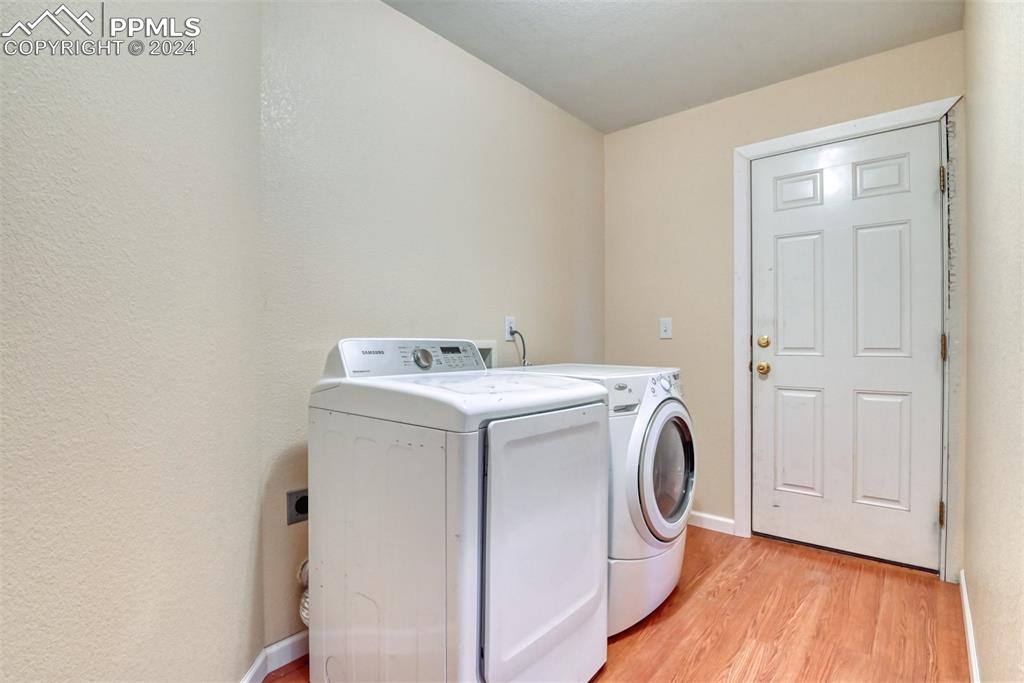 7863 Buschborn Road Peyton, CO 80831 - Photo 17 of 50 a utility room with dryer and washer