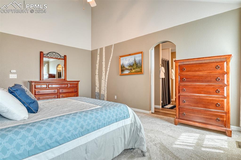 7863 Buschborn Road Peyton, CO 80831 - Photo 20 of 50 a bedroom with a bed and a cabinets