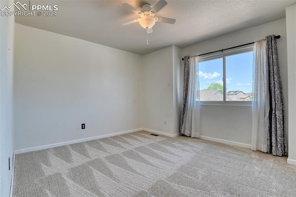 7863 Buschborn Road Peyton, CO 80831 - Photo 29 of 50 an empty room with windows and closet