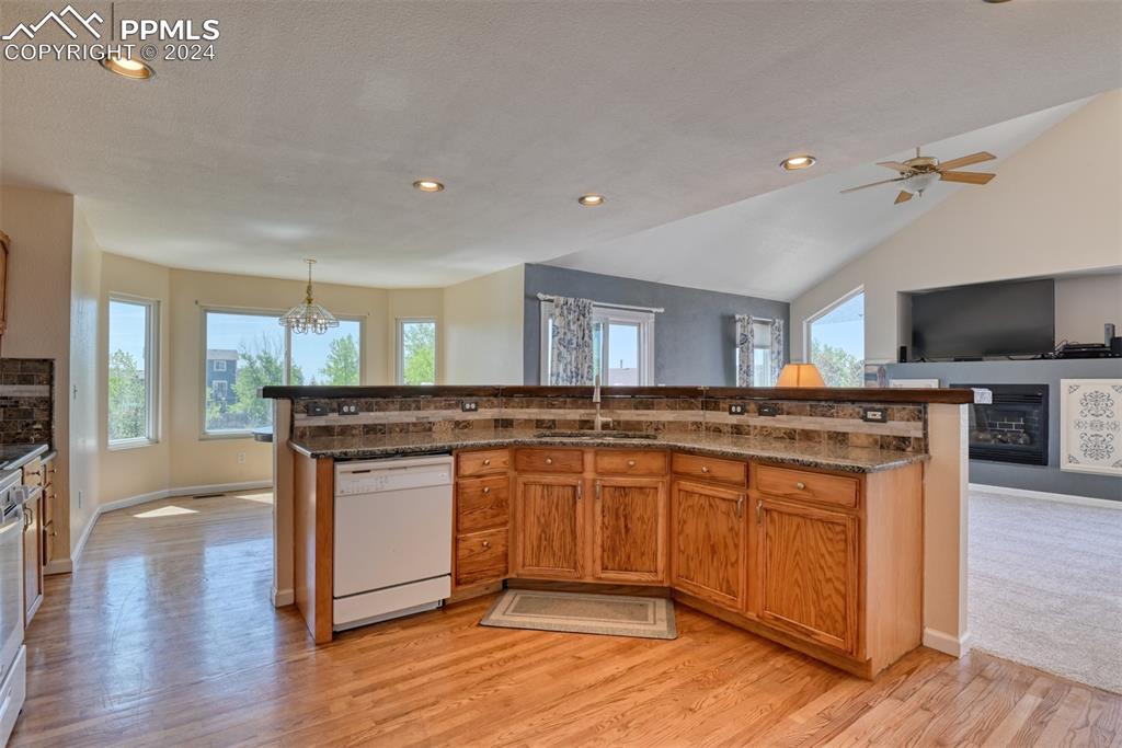 7863 Buschborn Road Peyton, CO 80831 - Photo 4 of 50 a kitchen with a sink and wooden floor