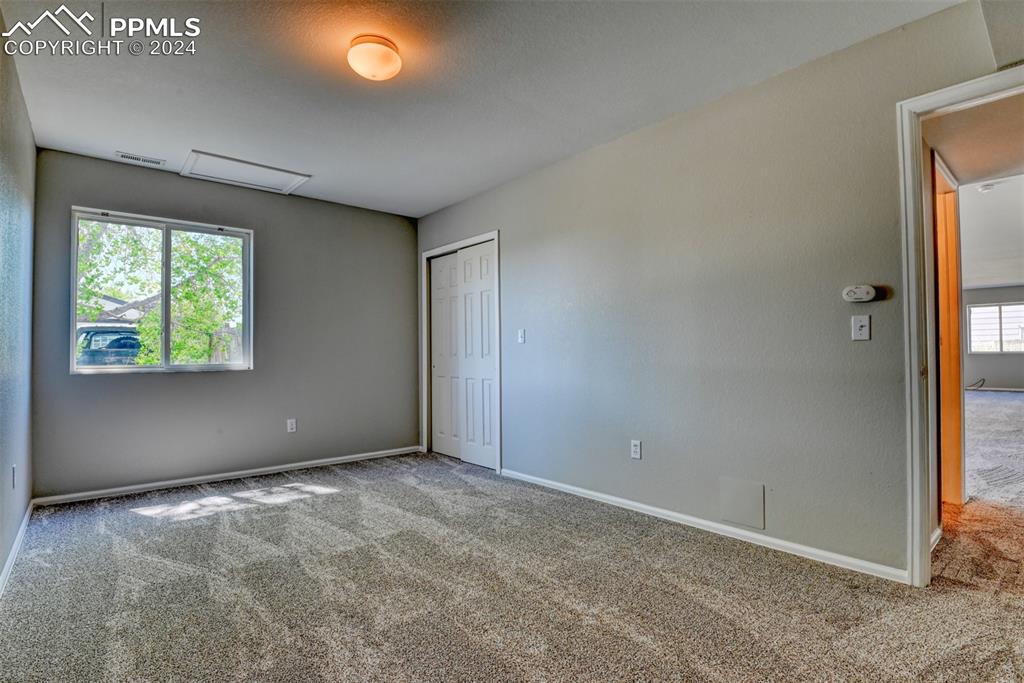 7863 Buschborn Road Peyton, CO 80831 - Photo 42 of 50 an empty room with windows