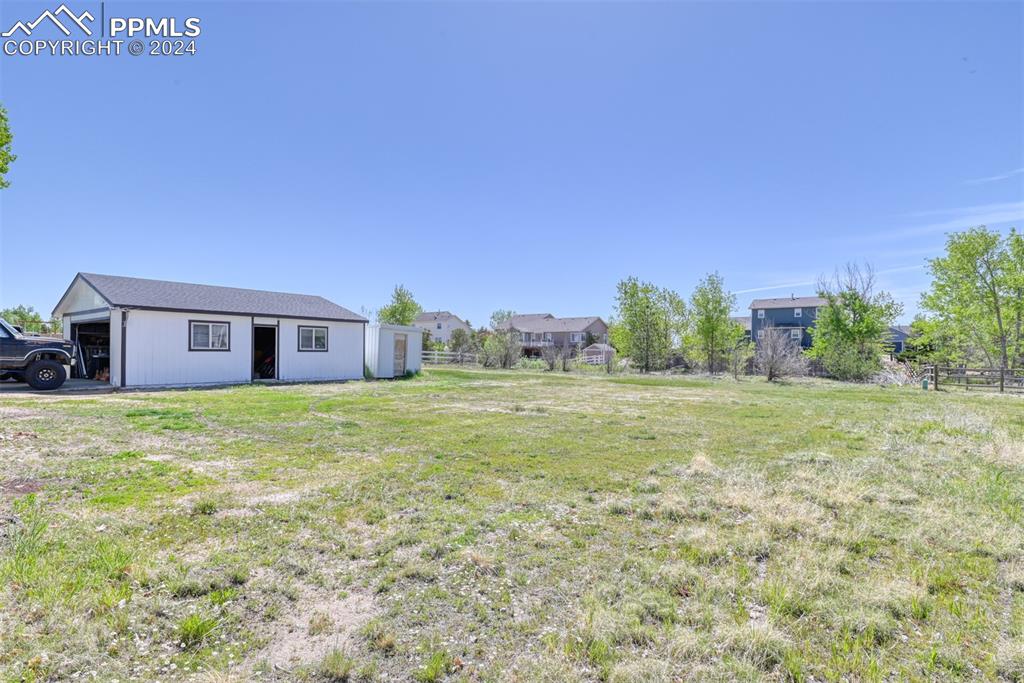 7863 Buschborn Road Peyton, CO 80831 - Photo 48 of 50 a view of a house with a yard