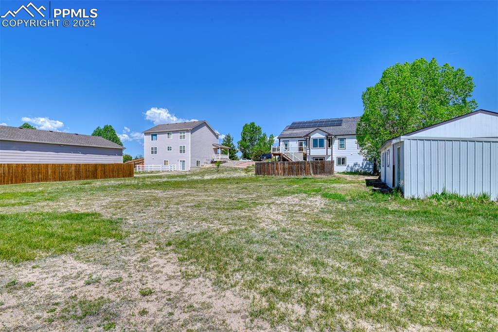 7863 Buschborn Road Peyton, CO 80831 - Photo 49 of 50 a view of a house with a yard
