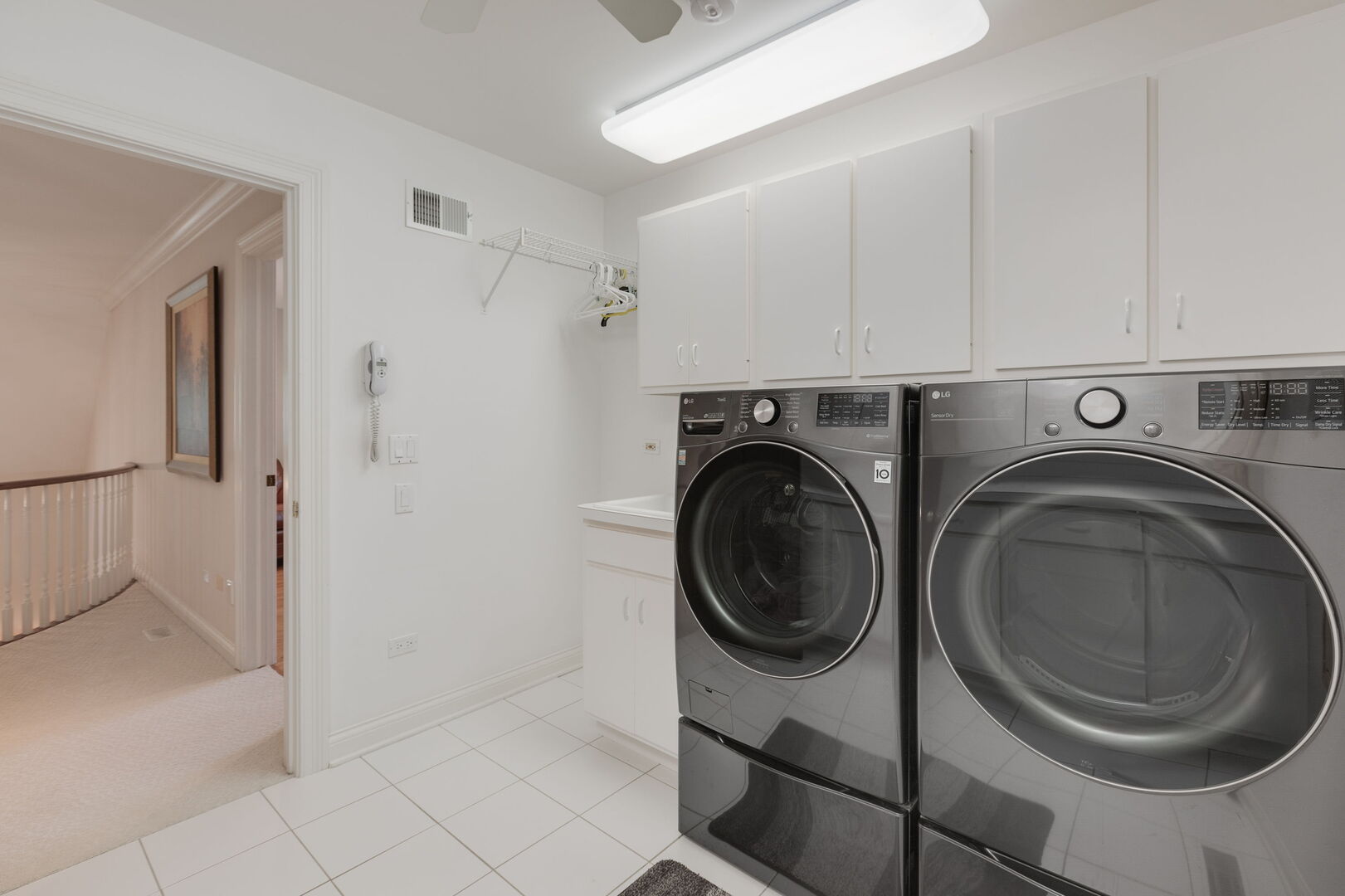 209 Carriage Trail Barrington, IL 60010 - Photo 27 of 42 a view of a hallway with washer and dryer