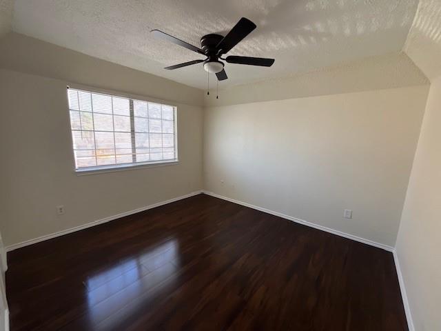 8127 Stonehurst Street, Unit 5 Dallas, TX 75217 - Photo 1 of 11 an empty room with wooden floor fan and windows