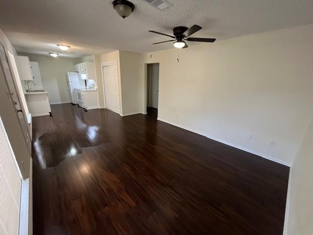 8127 Stonehurst Street, Unit 5 Dallas, TX 75217 - Photo 11 of 11 wooden floor in an empty room with a window