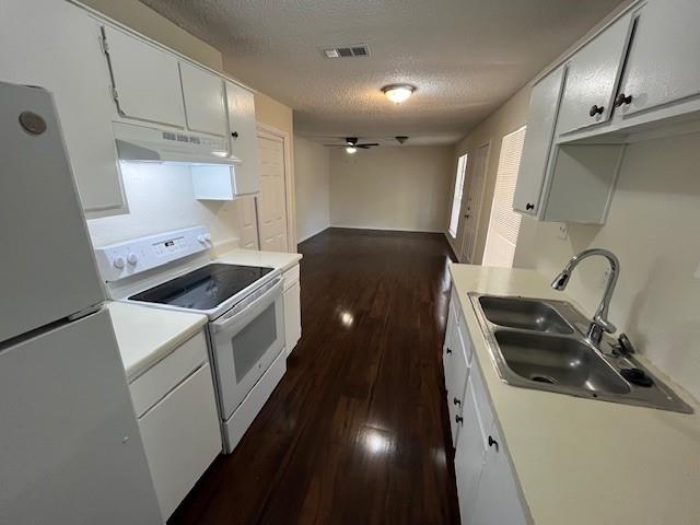 8127 Stonehurst Street, Unit 5 Dallas, TX 75217 - Photo 6 of 11 a kitchen that has a sink and a stove