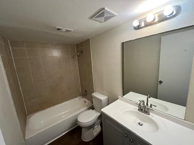 8127 Stonehurst Street, Unit 5 Dallas, TX 75217 - Photo 7 of 11 a bathroom with a sink a toilet and shower