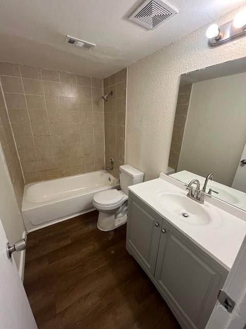 8127 Stonehurst Street, Unit 5 Dallas, TX 75217 - Photo 8 of 11 a bathroom with a granite countertop sink mirror vanity and toilet