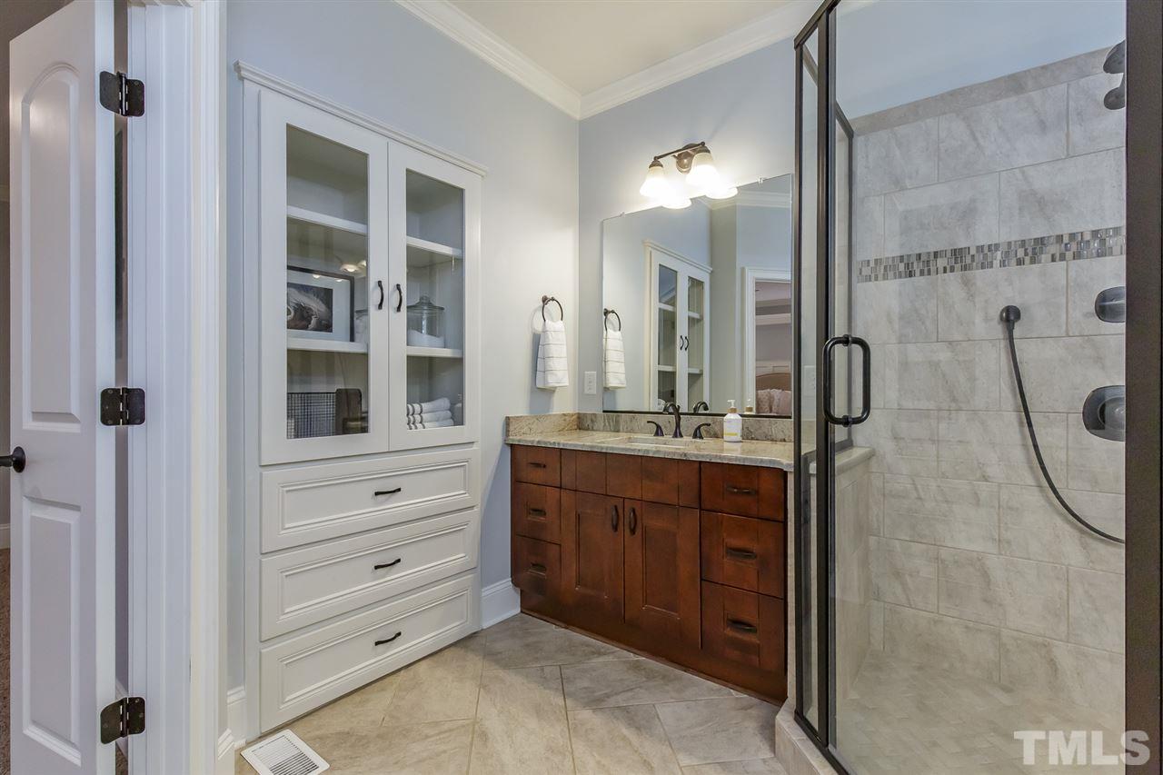 2514 Rogers Road Graham, NC 27253 - Photo 15 of 30 In-suite bath boasts 2 separate granite vanities and built-in cabinet and drawers
